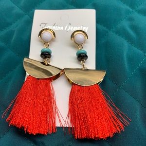 Red tassel earrings.